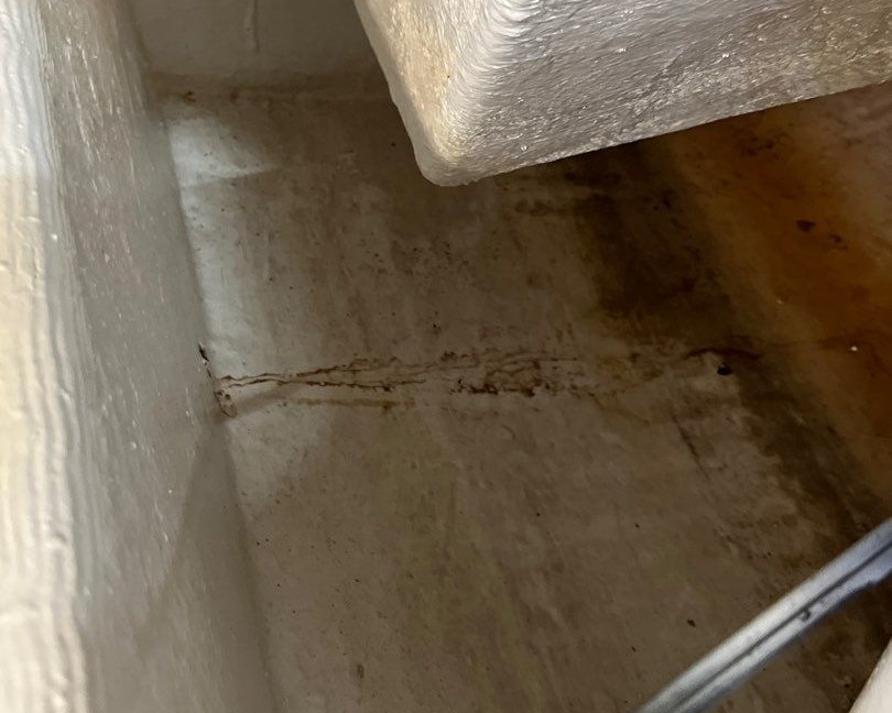 small trail of discolouration in a yacht engine room indicating there may be a sign of a small leak